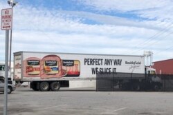 FILE - A truck arrives at Smithfield Foods' pork plant in Smithfield, Virginia, Oct. 17, 2019.