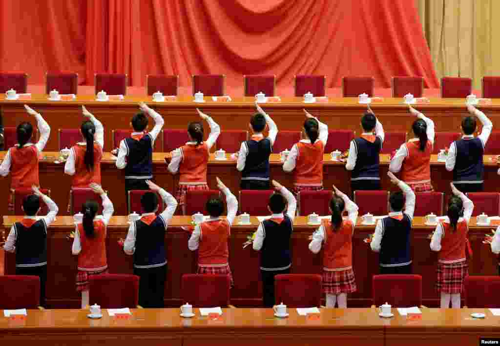 Students prepare for an event marking the 40th anniversary of China&#39;s reform and opening up at the Great Hall of the People in Beijing.
