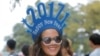 Chilean tourist Paula Aedo ushers in 2017 as she arrives to watch New Year's fireworks in Sydney, Australia, Dec. 31, 2016.