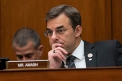 FILE - Rep. Justin Amash listens during a House committee hearing on Capitol Hill in Washington, June 12, 2019.