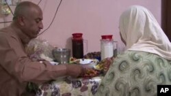 Samira Majeed and Feraas Hussein, a husband and wife living with their children in a mixed neighborhood in Baghdad.