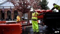 City workers place barricades around the court grounds during the first day of jury selection for the James Fields murder trial at Charlottesville Circuit Court in Charlottesville, Virginia, Nov. 26, 2018.