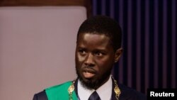 Senegal's newly elected President Bassirou Diomaye Faye takes the oath of office as president during the inauguration ceremony in Dakar