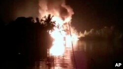 Foto yang diambil dari rekaman video 1 Maret 2019, tampak api dari ledakan pipa di Nembe, Nigeria.