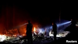 Firefighters make a stand in the backyard of a home in front of the advancing CZU August Lightning Complex Fire on Aug. 21, 2020, in Boulder Creek, Calif. 