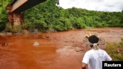 An Indigenous man from the Pataxo Ha-ha-hae tribe looks at Paraopeba river, after a tailings dam owned by Brazilian mining company Vale SA collapsed, in Sao Joaquim de Bicas near Brumadinho, Brazil, Jan. 25, 2019. 