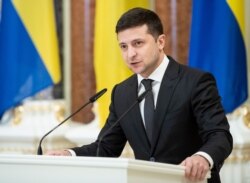 FILE - Ukrainian President Volodymyr Zelenskiy speaks in Kyiv, Dec. 4, 2019.
