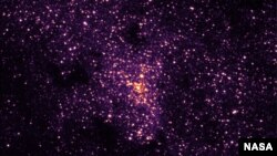 FILE - A near-infrared image of a black hole at the center of the Milky Way galaxy is seen with the Hubble Space Telescope/NICMOS. Astronomers have found new evidence for the existence of a mid-sized black hole. (NASA/STScI)