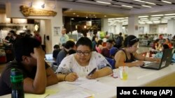 Students study in the Freudian Sip Cafe inside the newly-renovated Oviatt Library on the Cal State Northridge campus in Los Angeles.