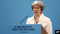 British Prime Minister Theresa May speaks during the Conservative Party's Spring Forum in London, March 17, 2018. 