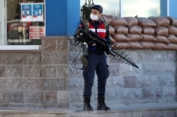 A Turkish soldier patrols next to the entrance of the Sincan Penal Institution at the 4th Heavy Penal Court near Ankara, on Nov. 26, 2020.