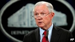 FILE - United States Attorney General Jeff Sessions speaks during a news conference at the Justice Department in Washington, Dec. 15, 2017. 