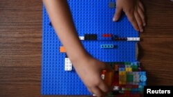 Sawyer Roellchen, 5, plays with Legos in his family's new home at Lackland Air Force Base in San Antonio, Texas, Nov. 16, 2019.