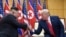 FILE - In this June 30, 2019, file photo, U.S. President Donald Trump, right, meets with North Korean leader Kim Jong Un at the border village of Panmunjom in the Demilitarized Zone, South Korea.
