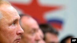 Russian President Vladimir Putin attends a meeting during his visit to Far East Zvezda Plant in Bolshoy Kamen, about 20 kilometers (12 miles) from Vladivostok, Russia, Tuesday, Sept. 11, 2018.