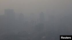A construction site is pictured in smog on a polluted day as a red alert for air pollution is issued in Beijing, China, Dec. 16, 2016. 