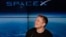 FILE- Elon Musk, founder, CEO, and lead designer of SpaceX, speaks at a news conference after the Falcon 9 SpaceX heavy rocket launched successfully from the Kennedy Space Center in Cape Canaveral, Florida on Feb. 6, 2018.