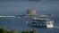 FILE - A Turkish navy submarine heads out in the Bosphorus toward the Marmara Sea, in Istanbul, Turkey, Aug. 7, 2020.