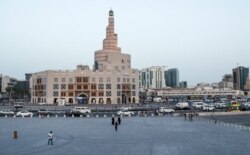 FILE - The Souq Waqif tourist bazaar is almost deserted in an effort to stop the spread of COVID-19, in Doha, Qatar, March 16, 2020.