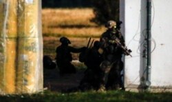 FILE - Soldiers of the German KSK attend an exercise close to Putgarten, Germany, Sept. 28, 2015.