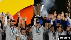 Shohei Ohtani and team Japan celebrate with the World Baseball Classic trophy after defeating the USA in the World Baseball Classic Mar. 21, 2023. (Rhona Wise-USA TODAY Sports)