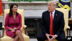President Donald Trump meets with outgoing U.S. Ambassador to the United Nations Nikki Haley in the Oval Office of the White House, Tuesday, Oc. 9, 2018, in Washington. (AP Photo/Evan Vucci)
