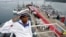 FILE - A Cambodian navy sailor salutes on a Chinese naval patrol boat during a handover ceremony at a Cambodian naval base at Ream in Sihanoukville province, southwest of Phnom Penh, on November 7, 2007. REUTERS/Chor Sokunthea