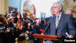 FILE - U.S. Senate Majority Leader Mitch McConnell speaks to Capitol Hill reporters following the weekly Senate Republican policy lunch at the U.S. Capitol in Washington, Jan. 14, 2020. 