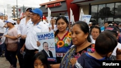 Supporters gather as presidential candidate Alejandro Giammattei of 'Vamos' political party holds his closing campaign rally ahead of the second round run-off vote in Guatemala City, Guatemala, Aug. 4, 2019.
