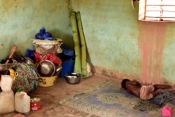 FILE - A newly displaced child from Dablo, sleeps inside a house in the city of Kaya, Burkina Faso, May 16, 2019.