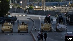 Egyptian army armoured personnel carriers (APC) are seen stationed in front of the Egyptian Museum in Tahrir Square in Cairo, Aug. 18, 2013.