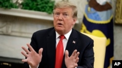 President Donald Trump speaks as he meets with NATO Secretary General Jens Stoltenberg in the Oval Office of the White House, April 2, 2019, in Washington.