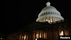 FILE - The U.S. Capitol building at night