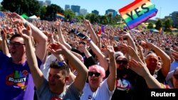 Supporters of the 'Yes' vote for marriage equality celebrate after it was announced the majority of Australians support same-sex marriage in a national survey.