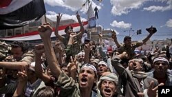 Anti-government protesters shout slogans during a demonstration demanding the resignation of Yemeni President Ali Abdullah Saleh, in Sana'a, Yemen, April 25, 2011