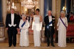 FILE - Queen Elizabeth II, President Donald Trump, first lady Melania Trump, Prince Charles and Camilla, Duchess of Cornwall, pose for a photograph ahead of a State Banquet.