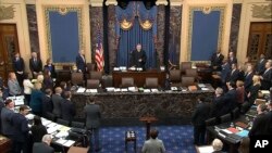 Presiding officer Chief Justice of the United States John Roberts arrives for the start of the impeachment trial against President Donald Trump in the Senate at the U.S. Capitol in Washington, Jan. 30 2020, in this image from video.