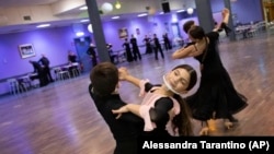 Young dancers, wearing face masks train at the New Dancing Days business in Rome, Italy, on March 24, 2021. (AP Photo/Alessandra Tarantino)