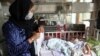 Babies lie in their beds at the Ataturk Children's Hospital a day after they were rescued following a deadly attack on another maternity hospital, in Kabul, Afghanistan, May 13, 2020. 