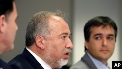 Israeli Defense Minister Avigdor Lieberman, center, speaks during a meeting with Defense Secretary Jim Mattis at the Pentagon, Oct. 19, 2017, in Washington.