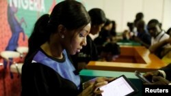 FILE - Youths are seen browsing the internet inside the venue of the launch of Google free wifi project in Lagos, Nigeria, July 26, 2018.