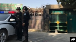 Visitors gather during a presentation visit of the &quot;Grand Palais Ephemere&quot;, with the Eiffel Tower seeing outside, in Paris, France.