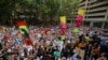 Protesters hold placards during a climate change rally in Sydney, Jan. 10, 2020.