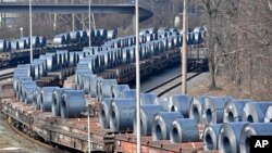 Steel coils sit on wagons when leaving the thyssenkrupp steel factory in Duisburg, Germany, March 2, 2018.