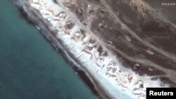 Satellite image of additional deployed Russian artillery along coastline at Vitino, Crimea March 31, 2023 in this handout image. 2023 Maxar Technologies/Handout via REUTERS