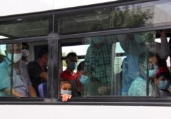 People wearing protective face masks, used as a preventive measure against the spread of the coronavirus disease (COVID-19), are seen inside a bus in Ashgabat, Turkmenistan, July 15, 2020.