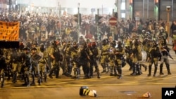 Riot police confront protesters during a rally on Christmas Eve in Hong Kong, Dec. 24, 2019. 