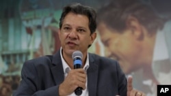 FILE - Fernando Haddad, presidential candidate for the Workers' Party, speaks to foreign journalists in Sao Paulo, Brazil, Oct. 18, 2018. Haddad will face Jair Bolsonaro in a presidential runoff on Oct. 28.