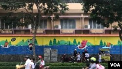 FILE - Children get picked up to go home after school in Ho Chi Minh City, Vietnam.