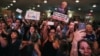 Members of the audience react as they listen to U.S. Democratic presidential candidate Bernie Sanders speak during a rally in the Manhattan borough of New York, June 23, 2016.